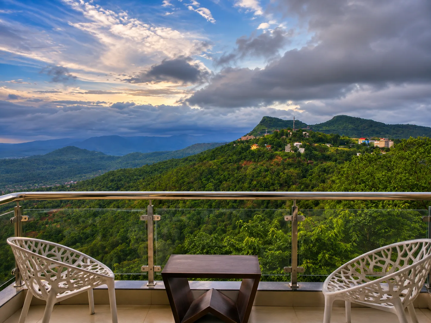 Wide green valley view from Toran Hill Resort in Saputara